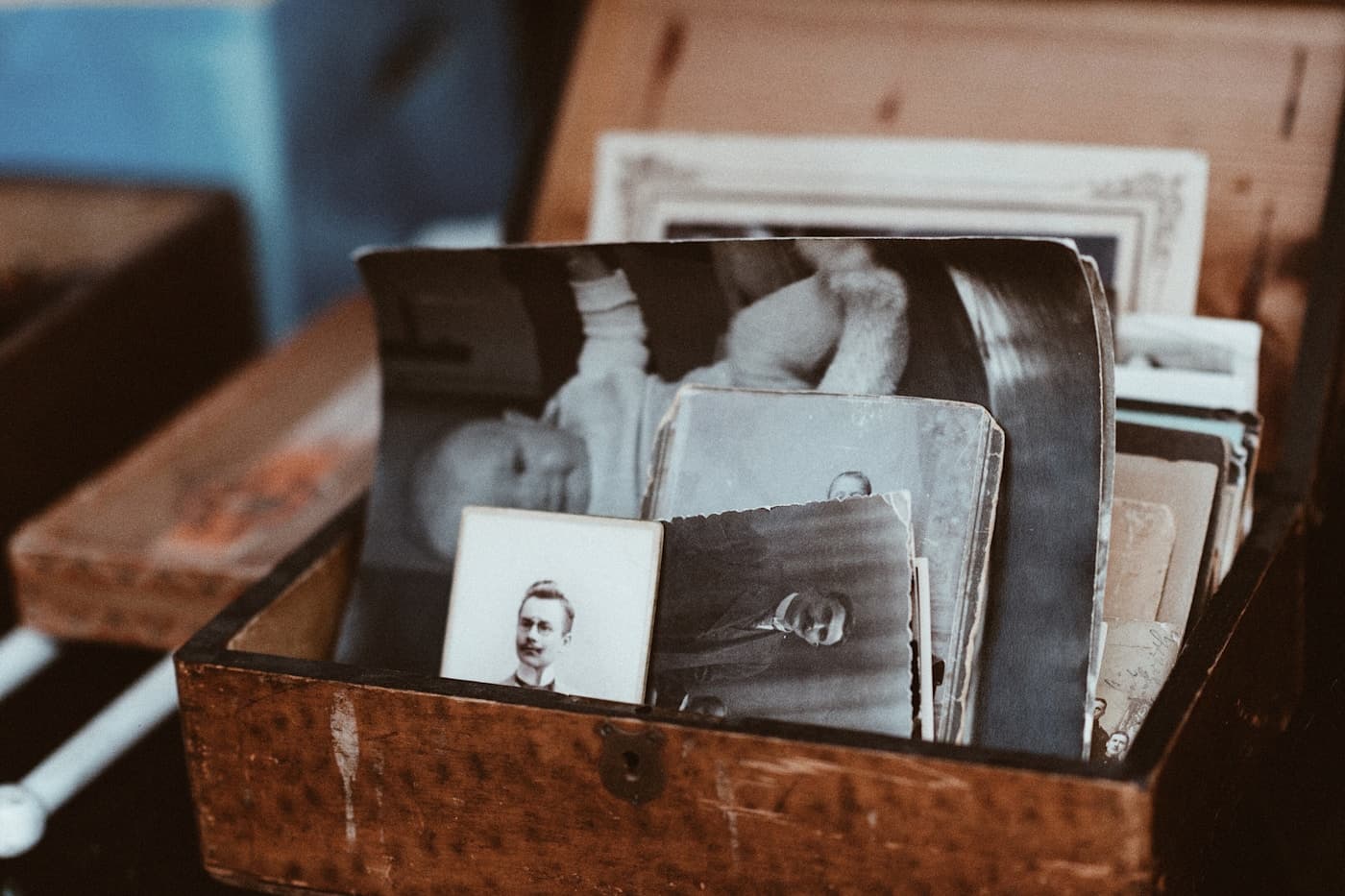 Old family photographs kept in a wooden box